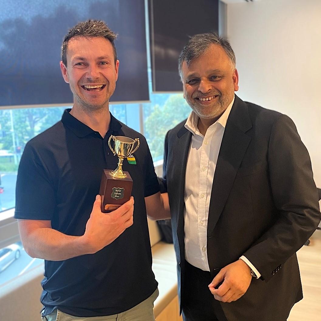 Liam Riordan presented with STAAR award by CEO Vik Bansal