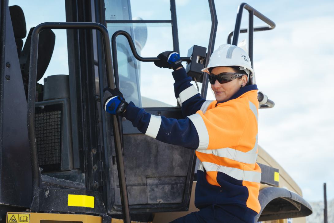 Female driver entering heavy vehicle