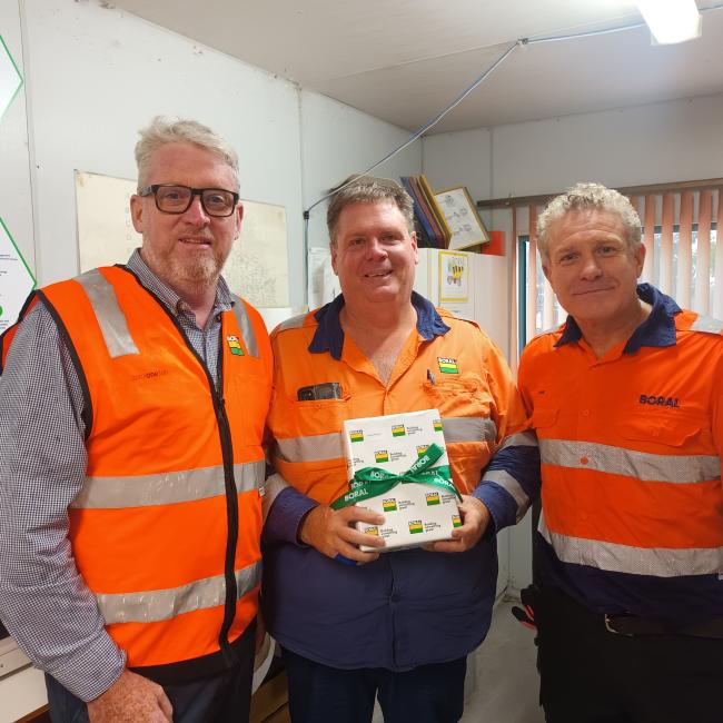 Photo of Michael Robinson with award, with Blake Senior and Paul Noakes.