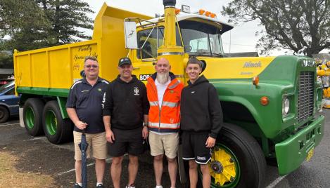 family standing in front of vintage Boral truck at Jamberoo Car Show 2025