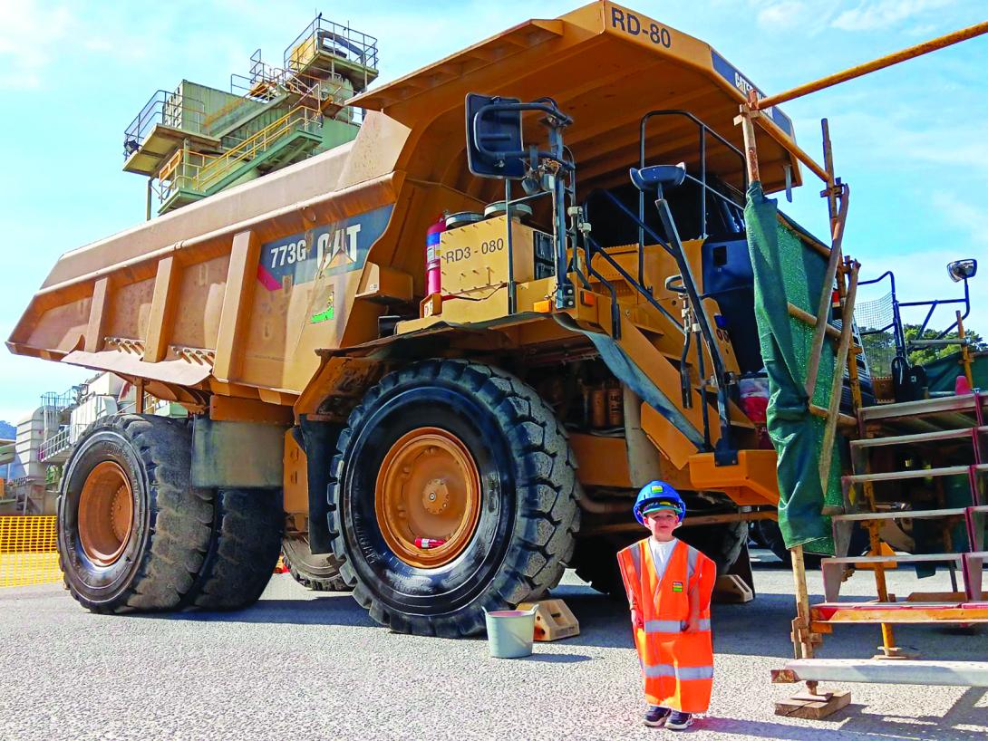 Reggie in PPE in front of Heavy Vehicle