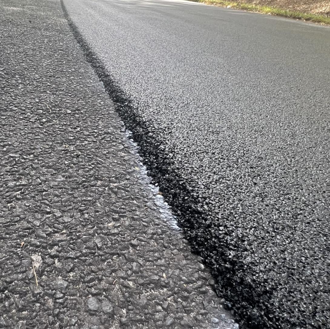 Road paved with asphalt mixed with crumbed rubber