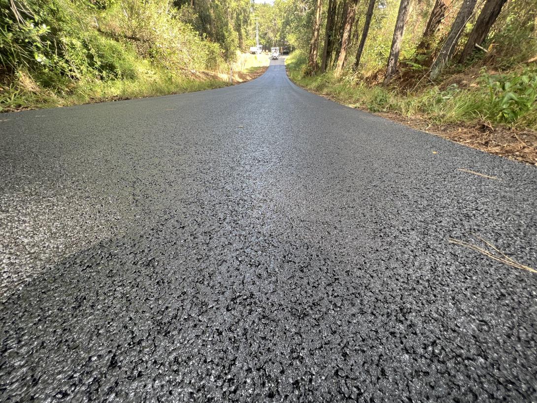 Road paved with asphalt mixed with crumbed rubber