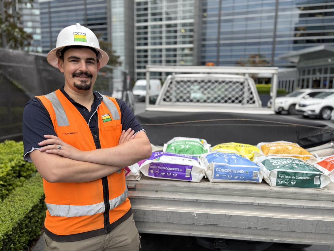 Tradie standing with Boral new plastic packaging